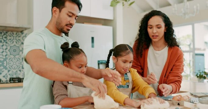 Family baking with dough together in the kitchen for dinner, supper or dessert in their home. Happy, bonding and girl children cooking with pastry with their young mother and father in their house.