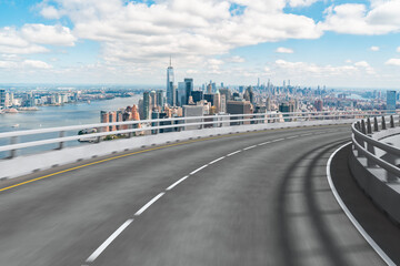 Obraz premium Empty urban asphalt road exterior with city buildings background. New modern highway concrete construction. Concept of way to success. Transportation logistic industry fast delivery. New York. USA.