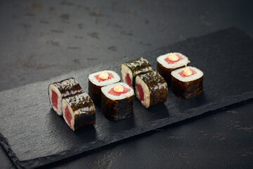 Roll with tuna on dark background. Sushi menu. Japanese food.