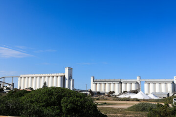 Thevenard Port salt piles and silos against blue sky © SCLifestyle
