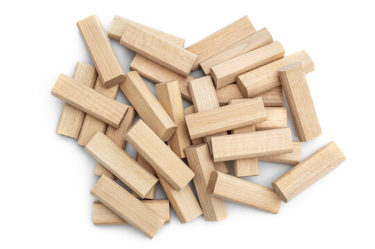 Heap of wooden blocks for kids game on white. Top view.