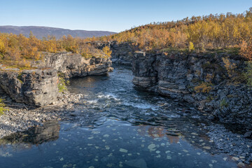 Fototapeta na wymiar Autum Abisko Canyon River Abiskojakka National Park, Norrbottens, Norrbottens Lapland landscape north of Sweden