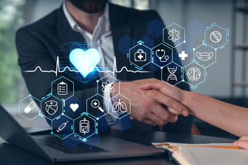 Businesspeople shake hands on great deal at office workplace. Concept of team work, business agreement, partnership, project success. Handshake shot. Medical icons.