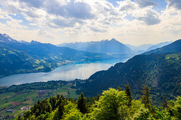 Naklejka na ściany i meble Breathtaking aerial view of Lake Thun and Swiss Alps from Harder Kulm viewpoint, Switzerland