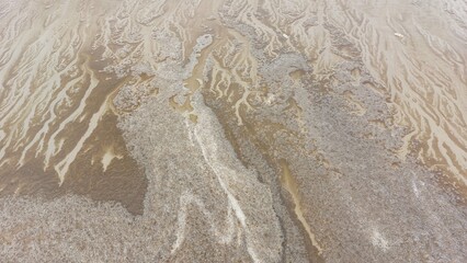 Close up of sand on the beach in winter. Abstract background.