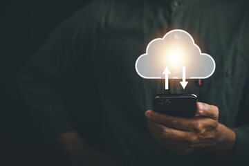 Utilizing a smartphone, a businessman taps into the power of internet technology, connecting to a storage network and a large database of big data. Immerse yourself in e-learning and online study.