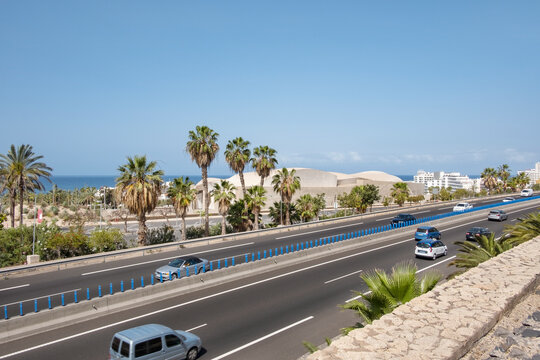 TF1 motorway connecting the southern part of the island, view from a bridge located between Magma Arts and Congress building and Siam Park, in Costa Adeje, Tenerife, Canary Islands, Spain