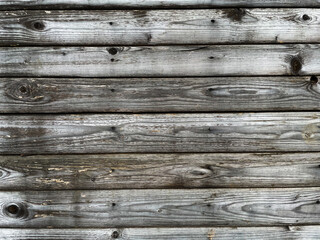 Fototapeta premium The grey boards are naturally weathered by rain and sun