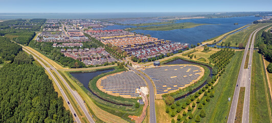 Aerial panorama from a solar Panel Farm with unique design in a form of an island at Almere...