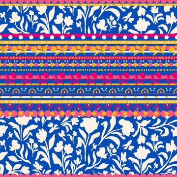 Multicolored flowers with leaves and geometric shapes boder seamless repeat pattern. Striped, bohemian botany all over surface print on blue background.