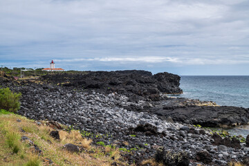 Lighthouse on Pico island / Lighthouse on the coast of Pico island, Azores, Portugal. - 621547032