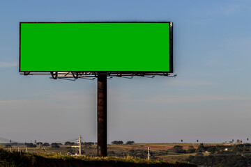 advertising sign with green background, spectacular billboard with chroma key in rural zone in Brazil