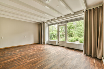 an empty living room with wood flooring and large windows in the room is very clean, ready to use