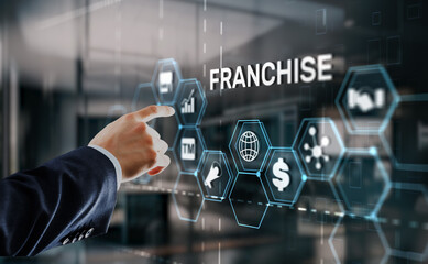 Businessman hand touching inscription Franchise marketing system