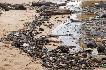 waste on beach, dirty sea pollution, garbage on beach after low tide, environmental pollution