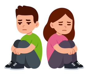 Sad boy and girl sitting on the floor