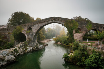 Fototapeta na wymiar Roman bridge over Sella river in Cangas de Onis, Asturias, Spain