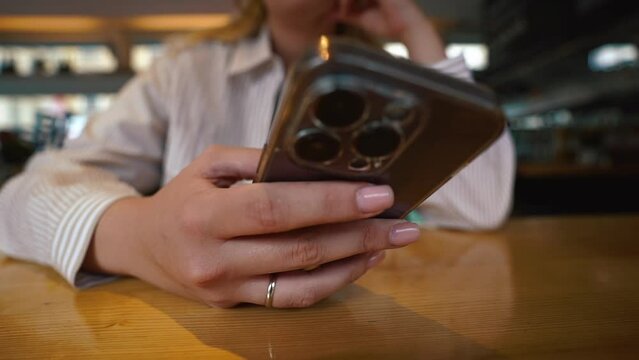 Close up of married female hands holding smartphone. enjoy online chat, internet purchase, browse web, download new cool freeware application. Modern wireless tech user concept. Wide close shot