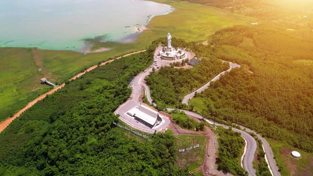 Aerial view of Our lady of Lourdes Virgin Mary catholic religious statue on a Nui Cui mountain in Dong Nai province, Vietnam.