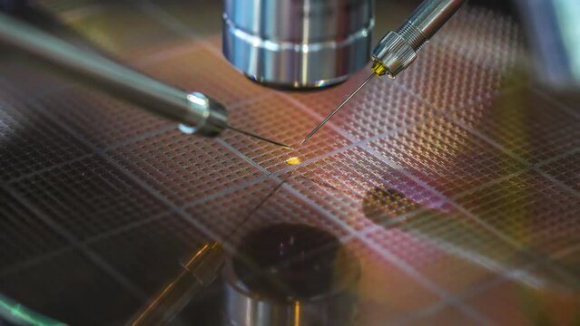 Check Micro Electronic Chip Under A Microscope.