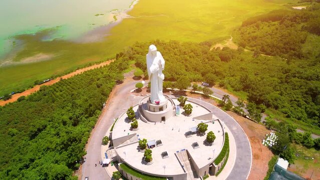 Aerial view of Our lady of Lourdes Virgin Mary catholic religious statue on a Nui Cui mountain in Dong Nai province, Vietnam.