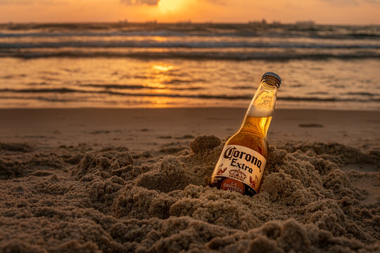 A bottle of cold beer Corona Extra on the beach golden hour, Ashdod, Israel, July 07 2023