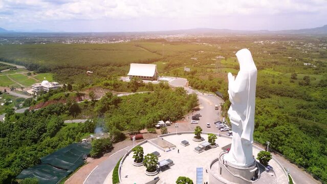 Aerial view of Our lady of Lourdes Virgin Mary catholic religious statue on a Nui Cui mountain in Dong Nai province, Vietnam.