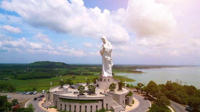 Aerial view of Our lady of Lourdes Virgin Mary catholic religious statue on a Nui Cui mountain in Dong Nai province, Vietnam.