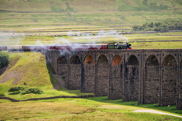 The Flying Scotsman Steam Train crossing The Ribblehead Viaduct, Yorkshire Dales, UK.