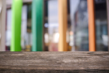 Empty wooden table in front of abstract blurred background of coffee shop . can be used for display or montage your products.Mock up for display of product.