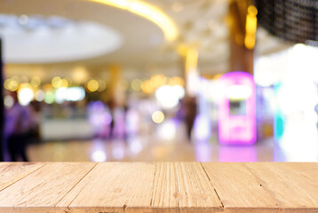 Empty wood table top and blur of night market background/selective focus .For montage product display.