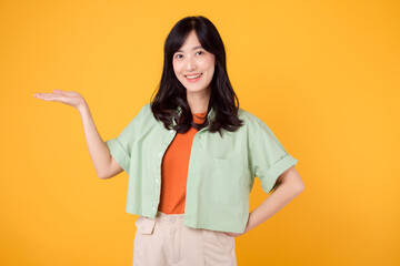 Vibrancy and joy portrait Asian young woman wears pastel green shirt on orange shirt and show happy...
