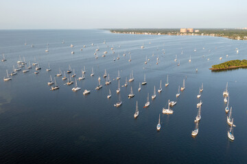 Aerial view of boats moored off Dinner Key Marina in Coconut Grove, Miami, Florida on calm clear...