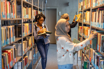 Group of diverse students in a library