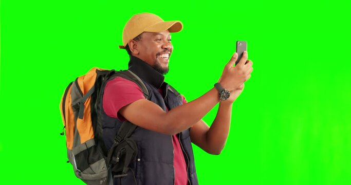 Selfie, green screen and black man with phone for travel photography on adventure, journey or hiking with backpack. Smartphone, taking pictures and happy memory of excited tourist trekking on a hike