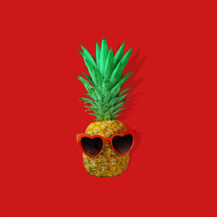 Creative summer layout made of pineapple with red heart shaped sunglasses against vibrant red background. Original pineapple decoration. Minimal summer concept.