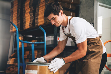 Small Business Owner's Caucasian Male Working in Coffee Beans Warehouse, Quality Coffee Production, Small Business Owner's Expertise in Coffee Roasting.