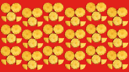 Creative summer mosaic made of pineapple slices against vibrant red background. Original pineapple decoration. Minimal summer concept.