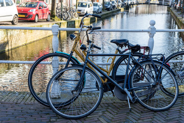 Netherlands, Delft, cycle standing over a bridge