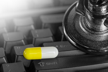 Stethoscope on a computer keyboard. Online medicine consultation concept.