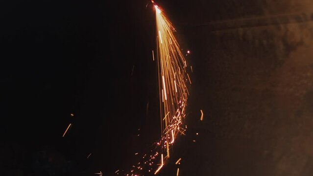Inside view. Metal pipe of large diameter is cut with autogenous and sparks fly. Opening sealed pipe. Scrap metal recycling. Video frame with cinematographic tinting.