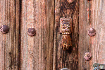 Beautiful small decoration of Fatima's hand at a door of a house in a Moroccan village
