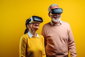 Fototapeta premium Senior mature couple having fun with virtual reality glasses. Old people using new headset goggles trends technology