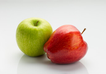 Apple and Pears. some exotic and some local produce on white background.
