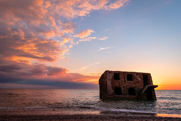 Beautiful and colorful sunset over the Northern forts in the Baltic sea coastline at Karosta (Liepaja, Latvia)