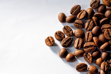 A close-up of roasted coffee beans can be used as a background for your coffee project