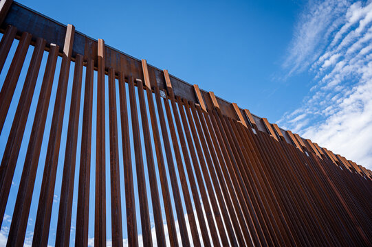 border wall and clouds