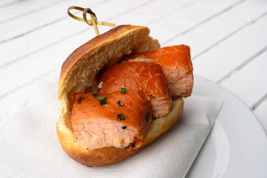 Fischbroetchen Fish Roll or Sandwich with Stremellachs Traditional Hot Smoked Salmon in Hamburg, Germany