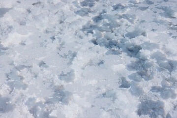 Close up of the salty water in the basins in the salt crust of the huge salt flats Salinas Grandes de Jujuy in northern Argentina while traveling South America