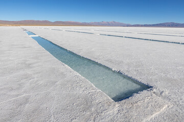 Basins in the salt crust of the huge salt flats Salinas Grandes de Jujuy in northern Argentina while traveling South America